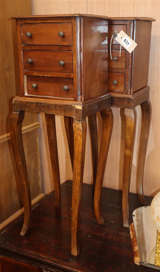 A pair of mahogany chests, each with three short drawers, on stands and squared angled cabriole legs H.71cm